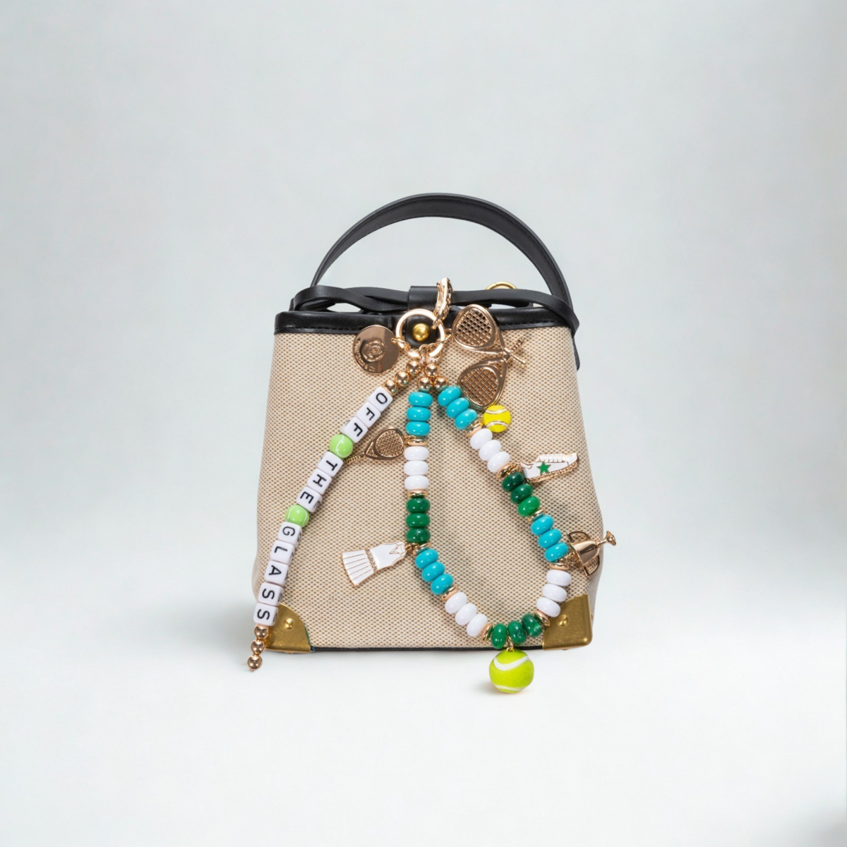 Padel Off The Glass bag charm with 18k gold-plated racket sports charms on chain links and neon cord